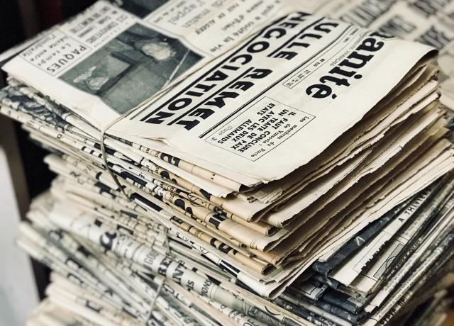 a stack of newspapers tied with string