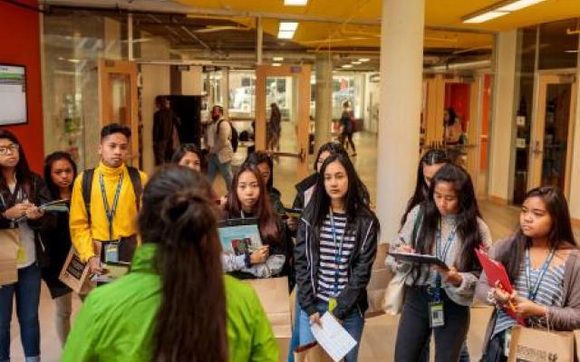 Campus Tour with students facing tour guide.