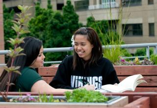 two students studying outside