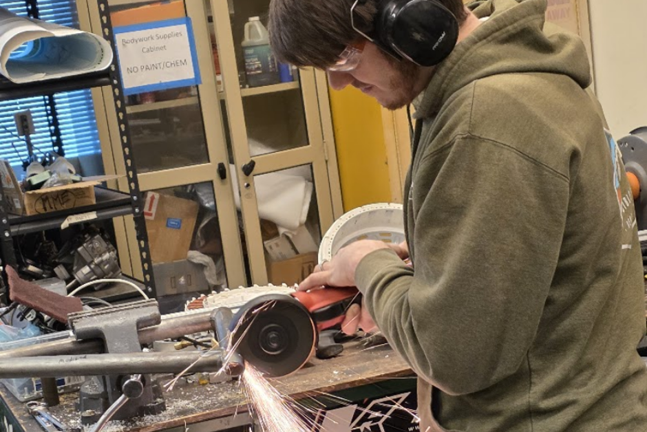 Mechanical Engineering Capstone student, Toby Greene, cutting steel pipe for the suspension of the Viking Motorsports SAE Baja 2026 vehicle - Engineering Building EB-495 - Portland State University, Maseeh College of Engineering and Computer Science