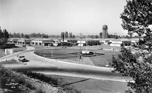 Vanport street scene with residences and water tower in the background. (1943)