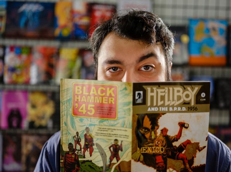 Student holding a Dark Horse comic