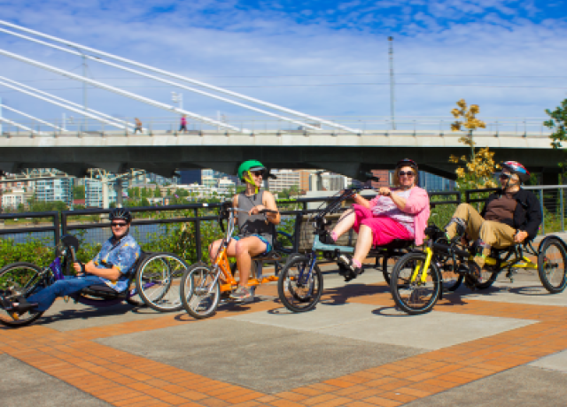 Adaptive BIEKTOWN users riding along the Portland Waterfront