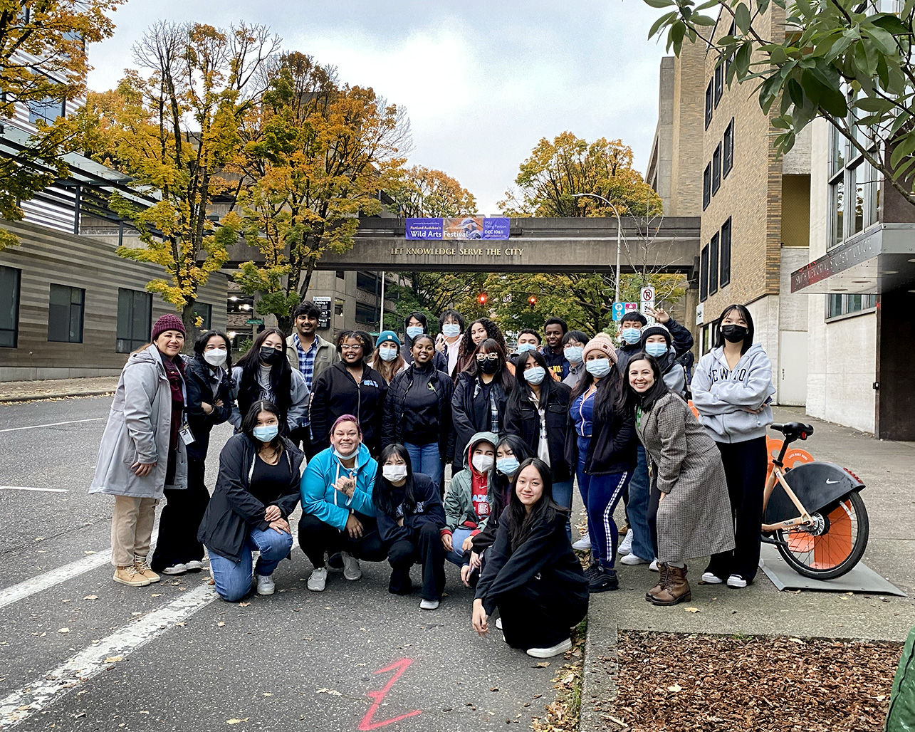 Students and staff on the Seattle college tours trip gather for a group photo outside P S U's Smith Memorial Student Union 