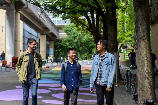 3 students walking. 