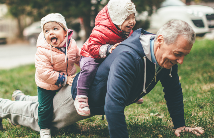 Grandfather doing push-ups with grandchildren