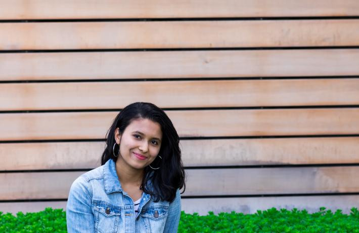 Student sitting in the grass