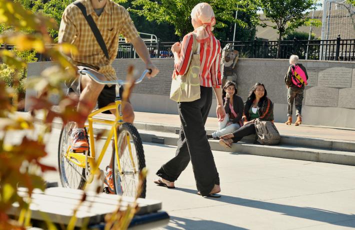Cyclist and pedestrian on campus