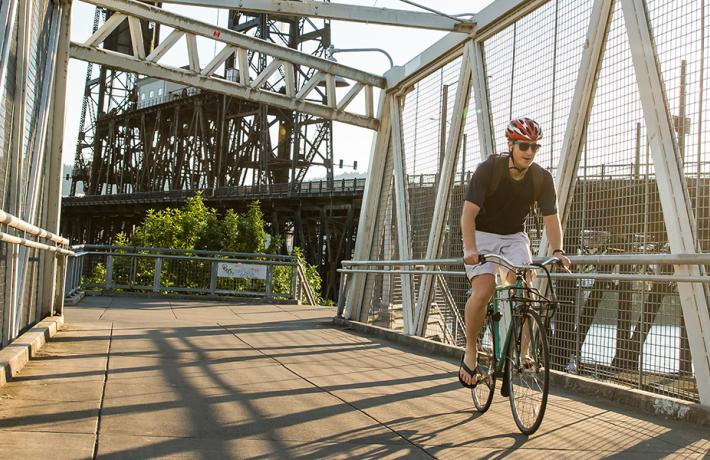 PSU student riding on a bike path