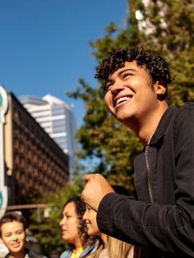 Students standing in front of theater