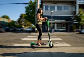 Woman riding on an electric scooter