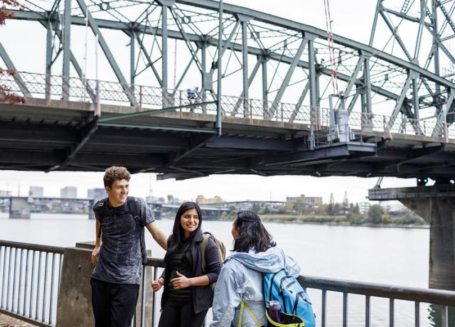 image of students in front of a bridge