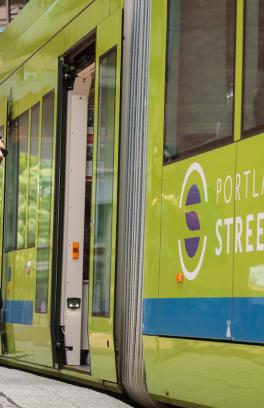 a student walking onto the street car