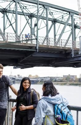 image of students in front of a bridge