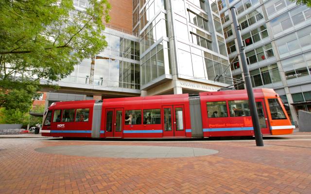 Photo of streetcar in urban center plaza