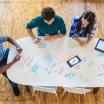 Students brainstorming at a table