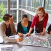 MURP students looking at a map