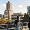 Two PSU Urban Studies students talking on a rooftop terrace