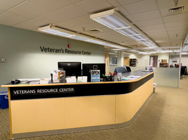 The front desk of the VRC (large and long with Veterans resource center displayed on one side)