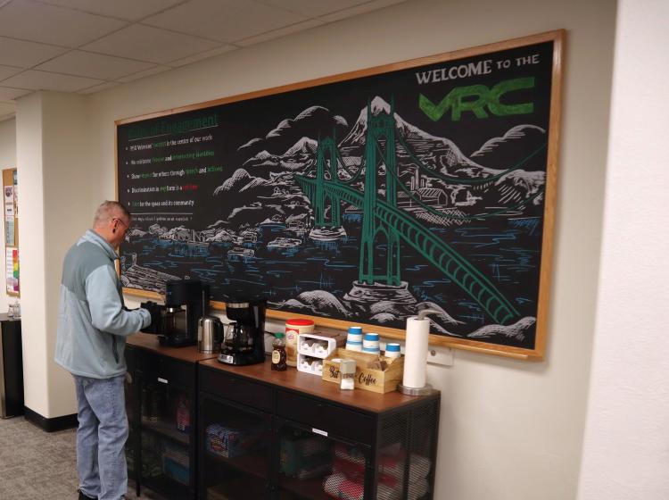 Student pouring coffee