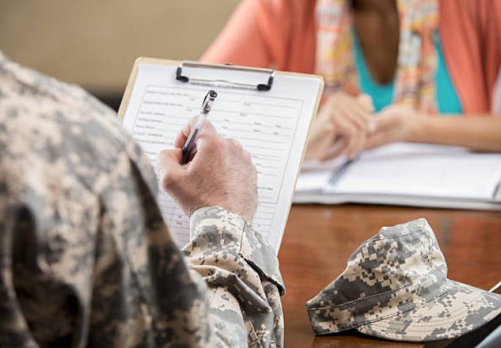 military uniform fills out form