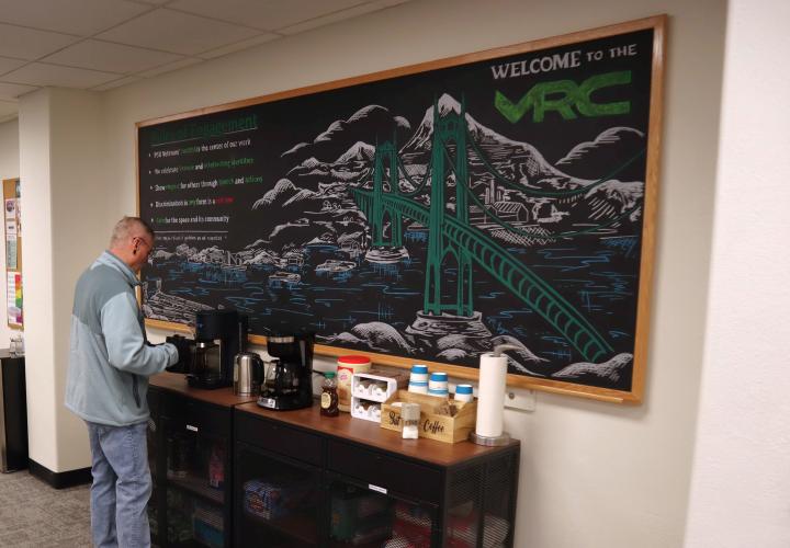 Student pouring coffee