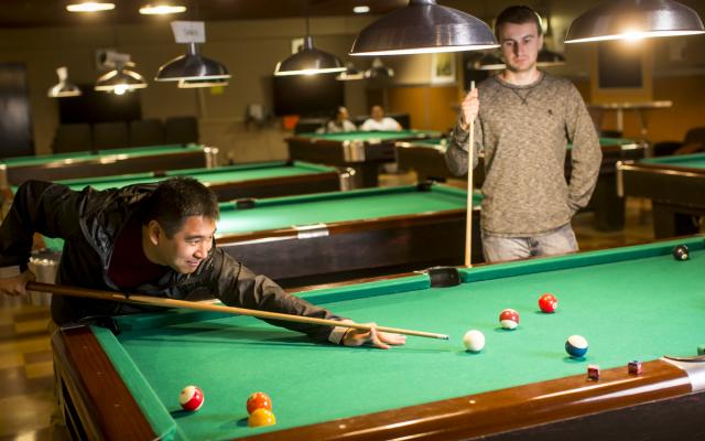 Students playing pool