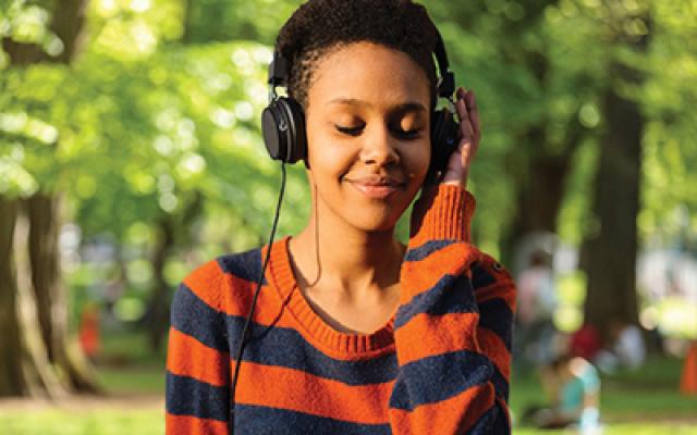 student listening to music on headphones
