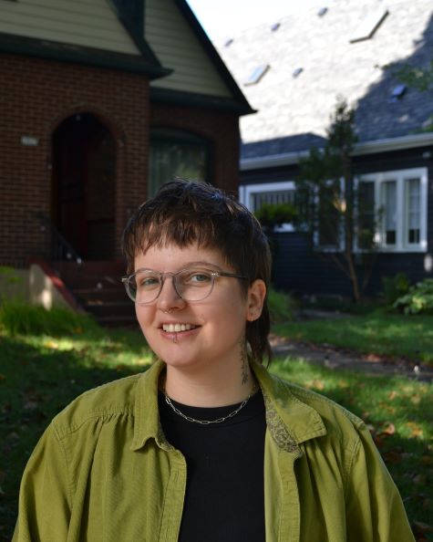 smiling grad student outside