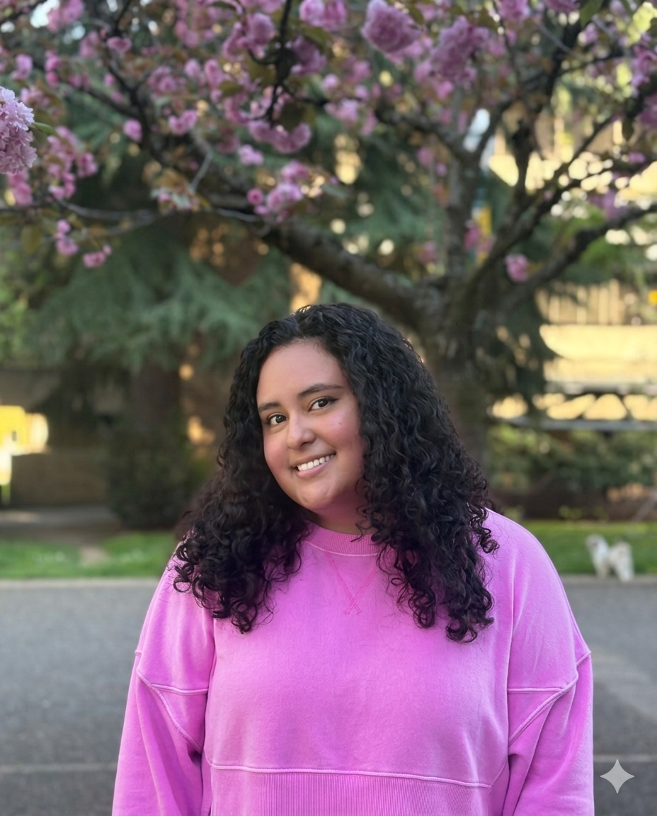 smiling graduate student outside