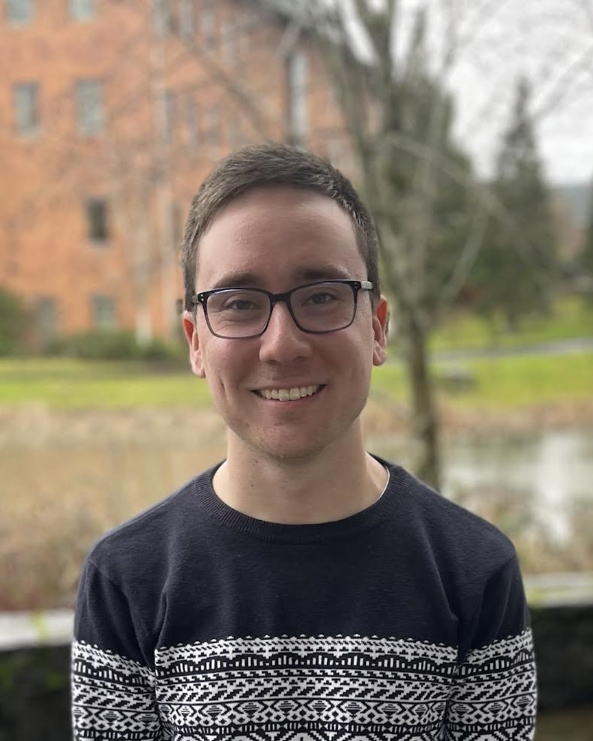 grad student with glasses on campus