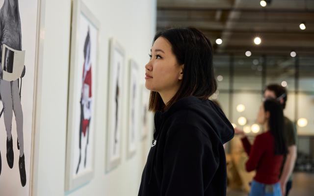 Student looking at a painting