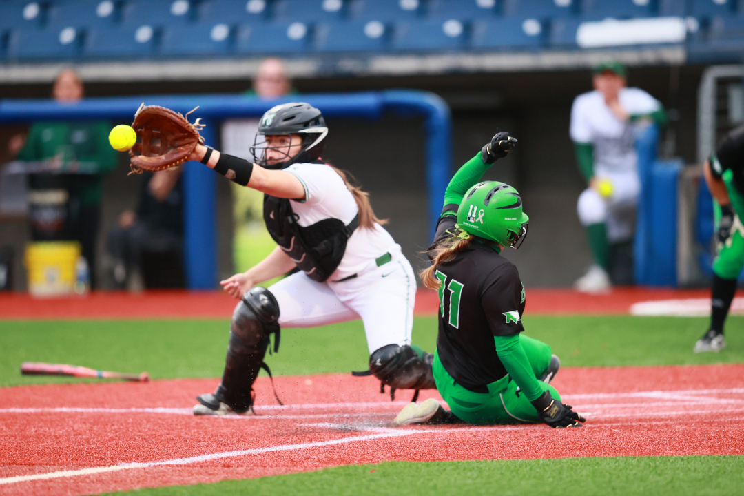 Allison Harris catching at home base