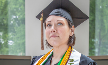 Brandi Swiderski pictured in commencement attire