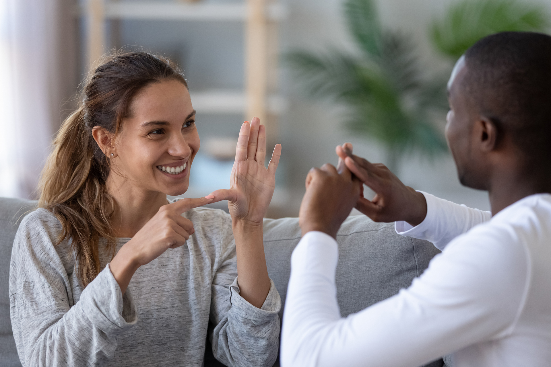 Two people communicating in sign language