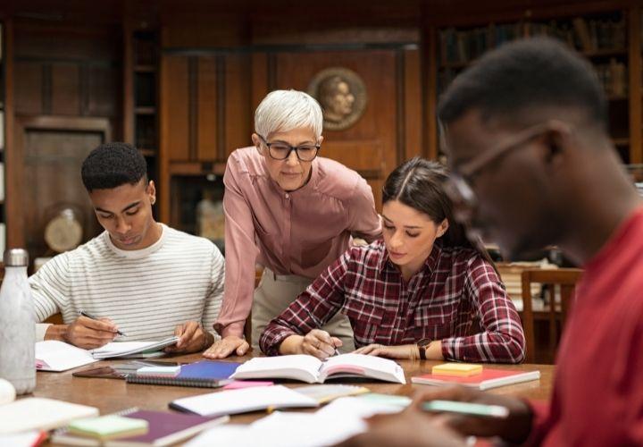 an image of an instructor and 3 students learning