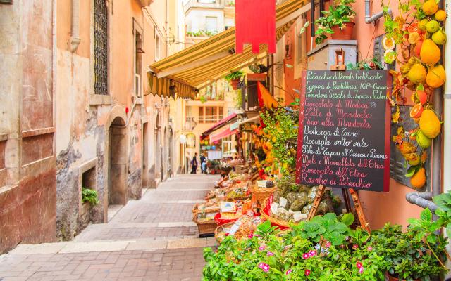 Side street in Italian city a with a vegetable/fruit market